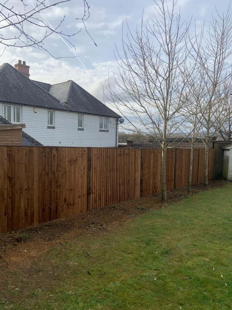 This is a photo of feather edge fencing installed in a residential properties garden by Fast Fix Fencing Spalding